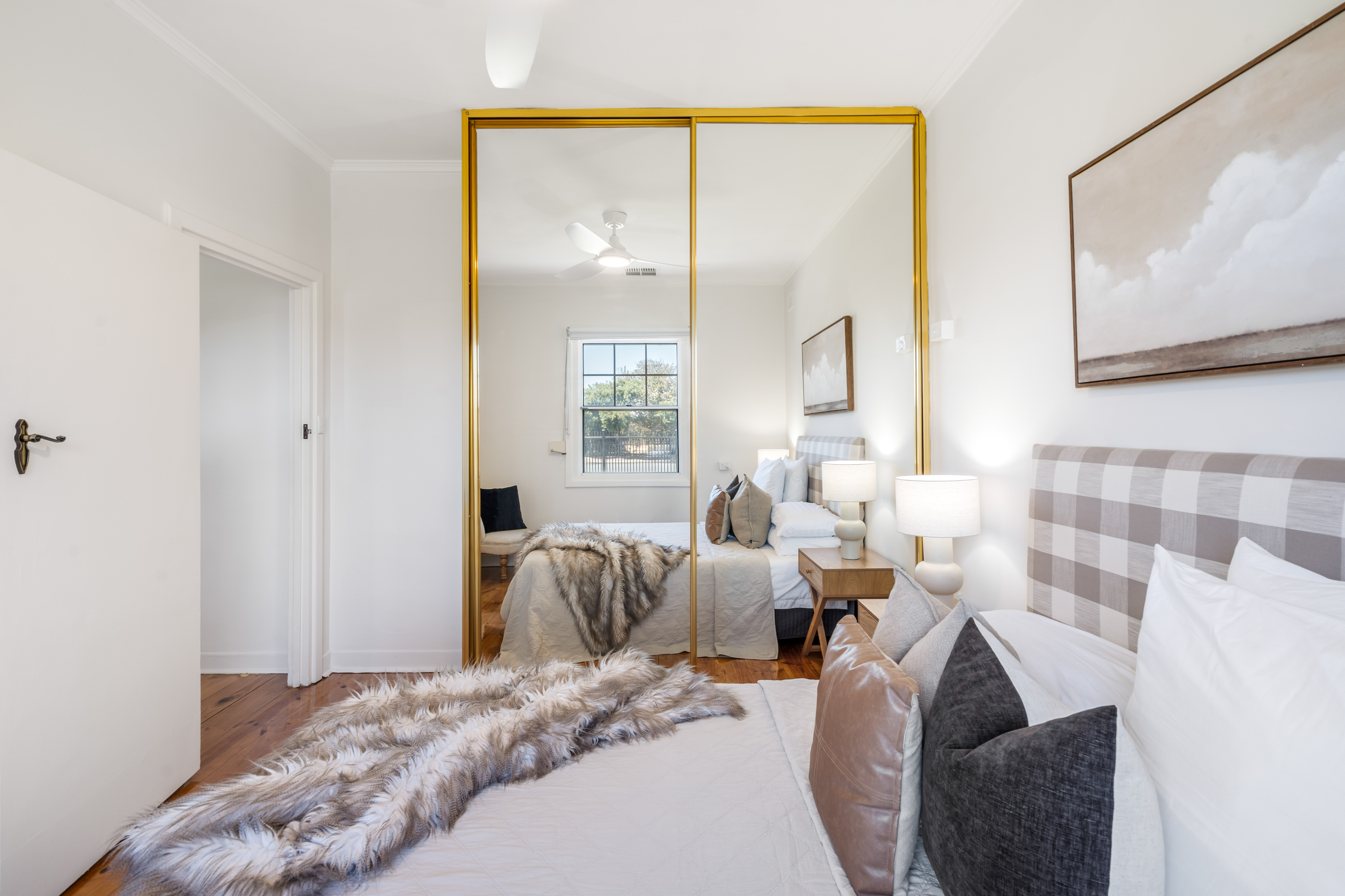 Master bedroom with mirrored wardrobe